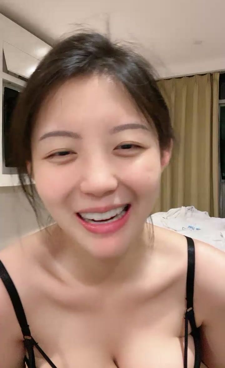 A woman in a suggestive pose her eyes burning with intensity